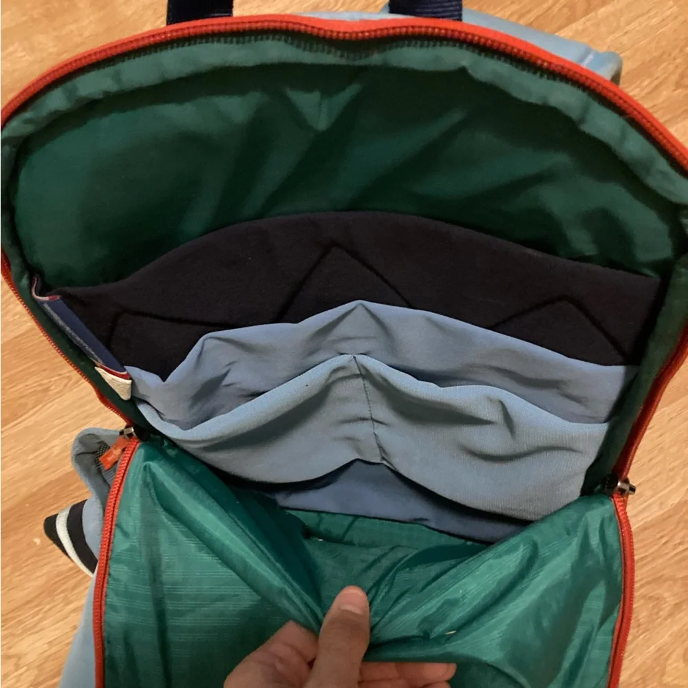 cotopaxi navy blue light blue green striped backpack